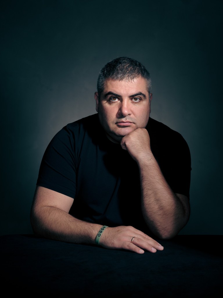 A fine art studio portrait of Azat Azatian, a Ukrainian advocate for the Portraits for Reparation project, photographed in The Hague, Netherlands by portrait photographer De Sheng Lim.