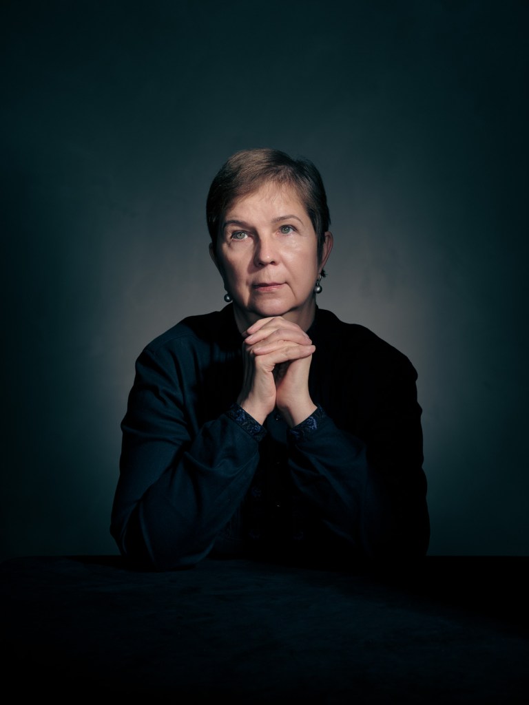 A fine art studio portrait of Iryna Dovgan, a survivor and prominent human rights advocate, for the Portraits for Reparation project in The Hague, Netherlands. Photographed by portrait photographer De Sheng Lim using classical lighting.