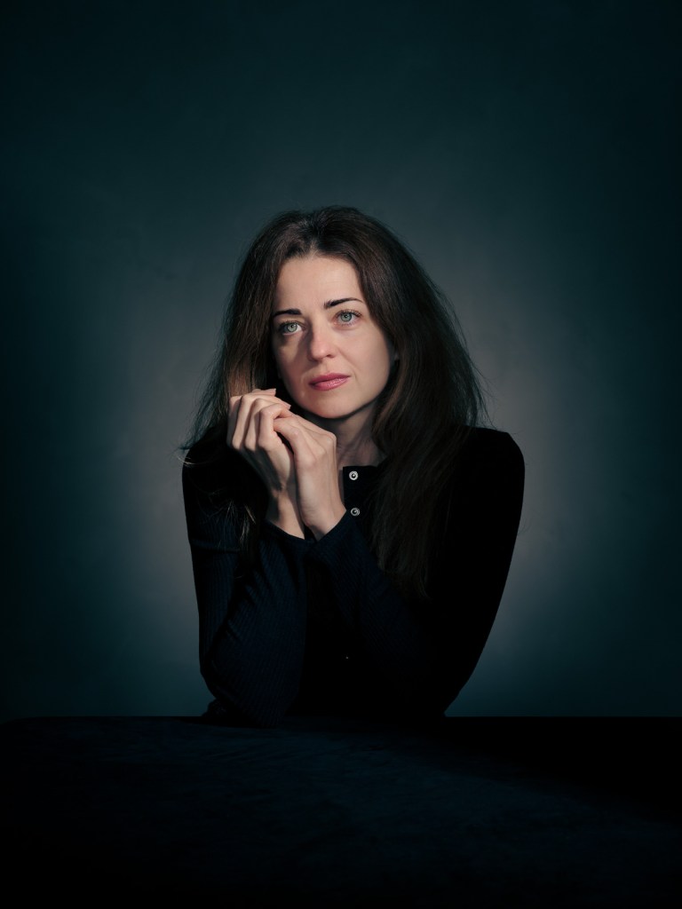 A fine art studio portrait of Iryna Kapalkina, a Ukrainian advocate for the Portraits for Reparation project, photographed in The Hague, Netherlands by portrait photographer De Sheng Lim.
