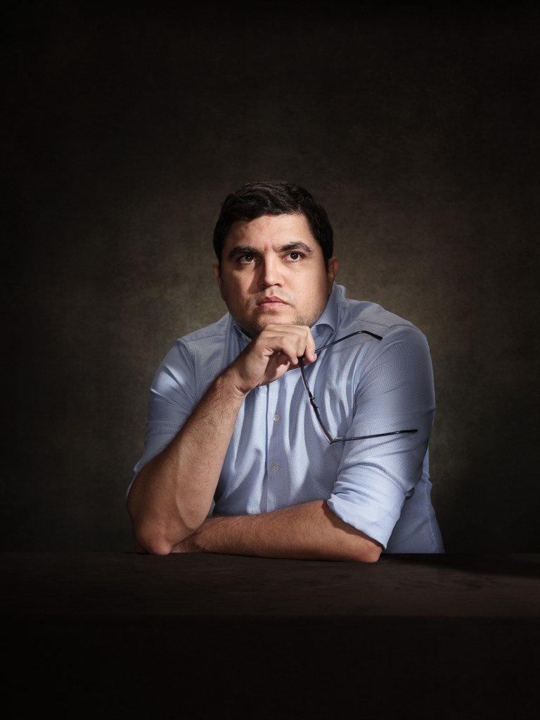 A fine art studio portrait of Luis Carlos Díaz, Venezuelan journalist, cyber activist, and human rights defender, for the "Survivors in Defence of ICC" project in The Hague, Netherlands, photographed by De Sheng Lim.
