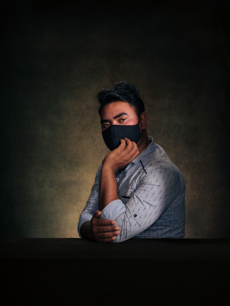 A fine art studio portrait of Monaira, a Hijra survivor advocate and member of the transgender Rohingya community, for the "Justice for Rohingya Survivors" project in The Hague, Netherlands, photographed by De Sheng Lim.