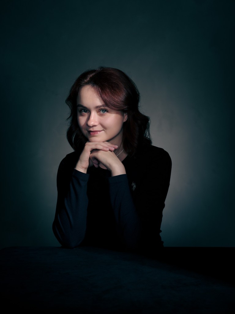 A fine art studio portrait of Yelyzaveta Shumska, a Ukrainian advocate for the Portraits for Reparation project, photographed in The Hague, Netherlands by portrait photographer De Sheng Lim.