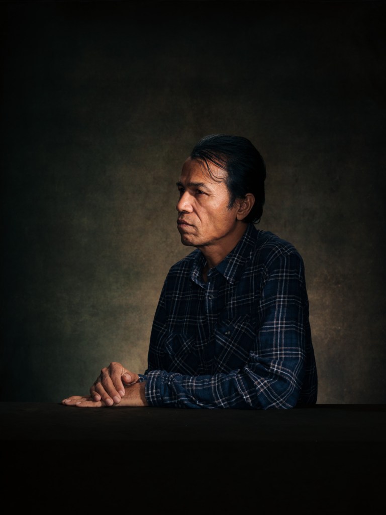 A fine art studio portrait of Yousuf, a Rohingya survivor advocate and human rights defender, for the "Justice for Rohingya Survivors" project in The Hague, Netherlands, photographed by De Sheng Lim.